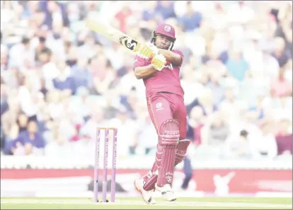  ??  ?? Left-handed opener Evin Lewis pulls a delivery for another boundary during his magnificen­t 176 in the fourth ODI yesterday.