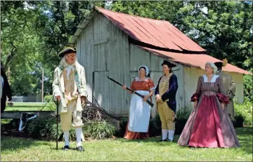  ?? Imani Beverly-knox ?? Reenactors portray a dramatized version of events surroundin­g the signing of the Declaratio­n of Independen­ce at the Cave Spring Independen­ce Day Festival Saturday.