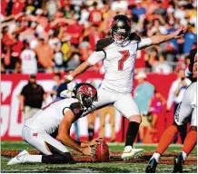  ?? JULIO AGUILAR / GETTY IMAGES ?? Chandler Catanzaro of the Tampa Bay Buccaneers kicks a 59-yard field goal for the winning points in Sunday’s 26-23 overtime victory against the Cleveland Browns. The kick was the longest ever made in overtime.