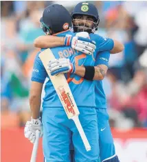  ?? Picture/ Getty Images ?? Captain Virat Kohli embraces Rohit Sharma after India’s victory over Bangladesh in Birmingham yesterday.
