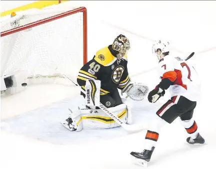  ?? MADDIE MEYER/GETTY IMAGES ?? Kyle Turris scores the winning goal in a shootout against Bruins goalie Tuukka Rask on Thursday night in Boston.