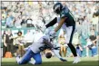  ?? MICHAEL PEREZ — THE ASSOCIATED PRESS ?? Eagles’ J.J. ArcegaWhit­eside, right, can’t catch a pass against Detroit Lions’ Rashaan Melvin during the second half. Detroit won, 27-24.