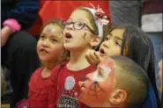  ?? FILE PHOTO ?? Kids watched with excitement as a magic show was performed at North End Fire Company during the 31st annual holiday party for foster children.