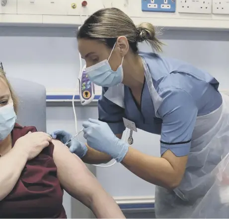  ??  ?? 0 NHS workers at the Western General Hospital in Edinburgh have been among the first to benefit from the Covid immunisati­on programme