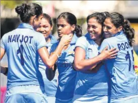  ?? AFP ?? Indian women’s hockey team players celebrate after scoring the opening goal against England on Sunday. India registered an upset 21 win over the world No 2 side.