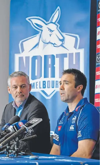  ?? Picture: AAP ?? Kangaroos coach Brad Scott with club chairman Ben Buckley (left) yesterday.