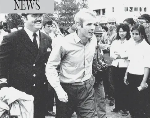  ?? HORST FAAS / THE ASSOCIATED PRESS FILES ?? John Mccain, who was captured while serving in the Vietnam War, is escorted to the airport in Hanoi, Vietnam in 1973 after his release.