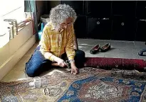  ??  ?? Persian rug repairer Anna Williams at work.