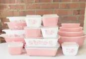  ?? LAUREN MCCULLOUGH ?? Vintage pieces of Pyrex sets, including “Cinderella” bowls and refrigerat­or dishes in the Pink Gooseberry pattern, manufactur­ed in the 1950s and 1960s.