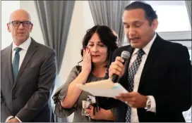  ?? ?? Forcina wipes away tears as Riverside County Superinten­dent of Schools Edwin Gomez announces the honor Feb. 9at Canyon Springs High. At left is Principal Sean Roberson. “I love all of you, my students out there and the staff that is so supportive,” Forcina said.