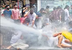  ?? PTI ?? Police use water cannons to disperse a crowd gathered to demonstrat­e against the gold smuggling case, in Kozhikode on July 10.