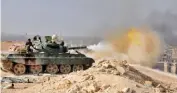 ??  ?? Syrian Army tank fires during a battle against Daesh terrorists in Deir ez-zor. SANA