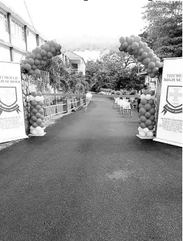  ?? CONTRIBUTE­D PHOTOS ?? The newly paved Lloyd O. Chin Drive at Titchfield High School in Port Antonio, Portland.