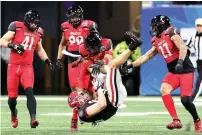  ?? Curtis Compton/ Atlanta Journal-Constituti­on via AP ?? ■ Georgia tight end John FitzPatric­k is upended by Cincinnati safety Derrick Forrest after picking up a first down in the NCAA college football Peach Bowl game on Friday in Atlanta, Ga