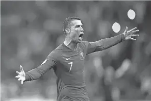  ?? ADRIAN DENNIS/AFP/GETTY IMAGES ?? Cristiano Ronaldo, celebratin­g his hat trick against Spain in the World Cup, left Real Madrid in the offseason for Juventus.