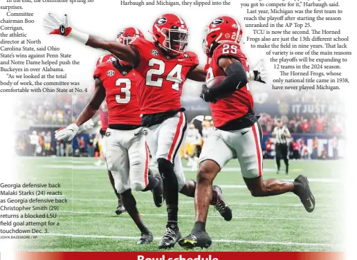  ?? JOHN BAZEMORE / AP ?? Georgia defensive back Malaki Starks (24) reacts as Georgia defensive back Christophe­r Smith (29) returns a blocked LSU field goal attempt for a touchdown Dec. 3.