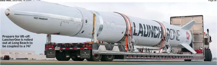  ??  ?? Prepare for lift-off: LancherOne is rolled out at Long Beach to be coupled to a 747