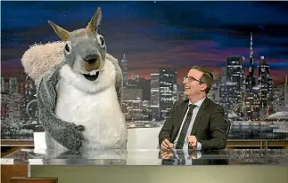  ?? PHOTO: HBO ?? John Oliver with ‘‘Mr Nutterbutt­er’’ during his item mocking US coal industry executive Robert Murray - a nod to an unfounded joke that Murray had begun operating his own mines because a squirrel had advised him to.