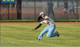  ?? TIM PHILLIS — FOR THE NEWS-HERALD ?? James Lavigne runs to make a catch for South in their district semifinal against Mentor.