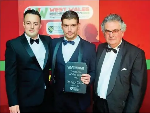  ??  ?? M&D Care receiving the 2020 West Wales Business of the Year award from Medwin Hughes of the University of Wales Trinity Saint David.