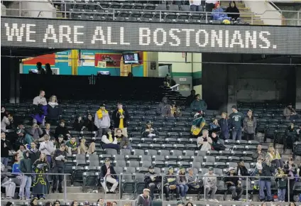  ?? BEN MARGOT/ THE ASSOCIATED PRESS ?? A sign proclaims support of Boston during the seventh- inning stretch of the Astros versus Athletics game in Oakland, Calif., on Tuesday.