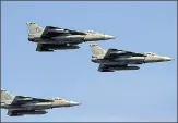  ?? AP ?? IAF’S Tejas jets during rehearsals ahead of Aero India 2021 at Yelahanka air base in Bengaluru on Tuesday.