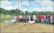  ?? PHOTO ?? ■ Villagers and family members of the two victims, Rajesh Sarkar, 19, and Tapash Burman, 21, have refused to cremate the bodies.HT