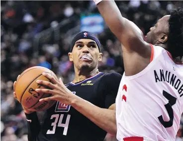  ?? — THE CANADIAN PRESS ?? The L.A. Clippers have dealt forward Tobias Harris, left, to the Philadelph­ia 76ers as the centrepiec­e of a six-person, four-draft pick swap.