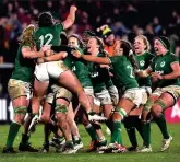  ?? ?? LATE SHOW: Ireland players mob Breen after her late conversion defeated Scotland