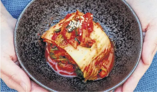  ?? BRENDAN DALZIEL ?? Kimchi, which is made from fermented cabbage, vegetables, fish sauce, garlic, ginger and chili paste, amongst other ingredient­s, is a beloved accompanim­ent to many Korean dishes.