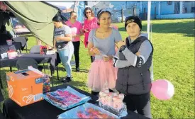  ??  ?? People Potential students Chyme Mane and Waitaha Yakas patronisin­g the cake stall.