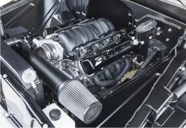  ??  ?? A POP OF THE HOOD REVEALS THE 2016 CHEVY PERFORMANC­E LS3 ENGINE THAT NOT ONLY LOOKS GREAT, BUT ALSO GIVES THE C10 A HUGE ADVANTAGE OVER MOST OTHER VEHICLES ON THE ROAD.