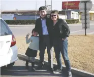  ??  ?? Wu Yuren poses with Karen Patterson and their daughter Hannah in April 2011, at his release site about 1.5 hours north of Beijing — far from media and supporters.