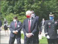  ?? Submitted photo ?? GOVERNOR VISIT: Gov. Asa Hutchinson, center, is followed by Bill Wussick, assistant director of Veteran Cemeteries, retired Army Col. Nate Todd, secretary of the Arkansas Department of Veterans Affairs, and Maj. Gen. Kendall W. Penn, adjutant general, Arkansas National Guard.