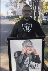  ?? Michael Gehlken Las Vegas Review-Journal ?? Mandeep Bajwa and the pencil sketch of quarterbac­k Derek Carr he made in 2015. He gave the sketch to Carr on Thursday outside of the team’s headquarte­rs in Alameda, Calif.