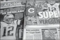  ?? AP/ENRIC MARTI ?? Mexican newspapers show headlines and photos Tuesday about the media executive suspected of stealing Tom Brady’s Super Bowl jersey (bottom left in photo with Brady). The headlines read in Spanish, “Super embarrassm­ent” (top right) and “Was stolen by a...