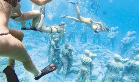  ??  ?? “Nest” by Jason deCaires Taylor is an underwater sculpture-slash-future home for soft corals found near Gili Trawangan, Lombok's uno cial party island, just a boat ride from Lombok or Bali. (Photo by Dickie Neri)