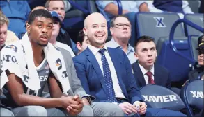  ?? Joe Robbins / Getty Images ?? Xavier assistant coach Luke Murray smiles during a 2017 game against Baylor in Cincinnati. Murray, now with UConn, has earned a reputation as a top-notch recruiter.