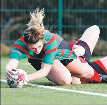  ??  ?? Kirsty Sinclair dives over for a try for Oban Lorne.