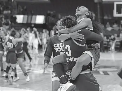  ?? Associated Press ?? Huge victory: Mississipp­i State's Morgan William, right, celebrates with Breanna Richardson (3) after a regional final against Baylor, Sunday in Oklahoma City. Mississipp­i State won in overtime 94-85 as William scored 41 points and was named Most...