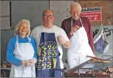  ??  ?? Cooking up a storm are Mary and Dougie Lyndsay, with Gordon McNab, centre.