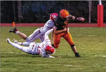  ?? PHOTOS BY JOSE QUEZADA, HUMEDIA — FOR THE TIMES-STANDARD ?? Ferndale’s defense forces a fumble on an Arcata drive, leading to a turnover.