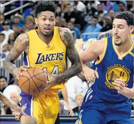  ?? Ethan Miller Getty Images ?? BRANDON INGRAM, checked here by Klay Thompson, scored 21 points Wednesday against the Golden State Warriors, making seven of 10 shots.