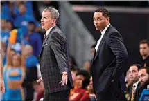  ?? MARK J. TERRILL / AP FILE ?? In this 2017 file photo, Southern California head coach Andy Enfield, left, talks to officials as assistant coach Tony Bland stands behind him during an NCAA basketball game against UCLA in Los Angeles.