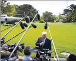  ?? DOUG MILLS / THE NEW YORK TIMES ?? President Donald Trump speaks with reporters Wednesday as he departed the White House, bound for an event in Indiana. “My plan is for the working people and my plan is for jobs,” he said before leaving.