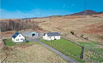  ?? ?? Two cottages and a farm building are included in the sale of the vast forestry estate.