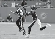  ?? [AP PHOTO/WILFREDO LEE] ?? Baltimore wide receiver Marquise Brown grabs a pass for a touchdown during the first half of the Ravens' win over Miami on Sunday in Miami Gardens, Fla. Brown had a dazzling NFL debut with four catches for 147 yards and two touchdowns.