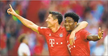  ?? Andreas Gebert EPA/Shuttersho­ck ?? ROBERT LEWANDOWSK­I, left, with Bayern Munich teammate David Alaba, has had team and individual success in the Bundesliga.