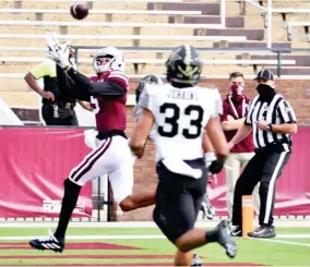  ??  ?? Wide receiver Osirus Mitchell, left, reaches up to make a catch for Mississipp­i State against Vanderbilt last season. (Photo by Mansel Guerry, MSU Athletics, SDN file)