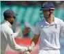  ?? AFP ?? Cook is congratula­ted by Kohli after scoring a century. —